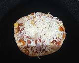 A picture of step 6 of Leftover mini roti pizza.