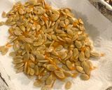 A picture of step 6 of Tray bake pumpkin & chicken thighs topped with roast pumpkin seeds.