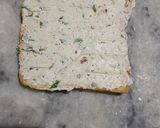 A picture of step 3 of Carrot toast with cheese spread.