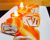 A picture of step 15 of Orange Marble Swiss Roll.