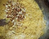 A picture of step 4 of Rava besan dry fruit laddu.