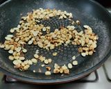 A picture of step 2 of Oats and Ground nut Laddu.
