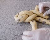 A picture of step 12 of Soft Chewy Braided Raisin Bread.