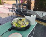 Foto del paso 14 de la receta Muslos de pollo con patatas en el pizzapan