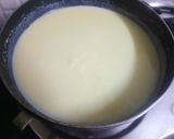 A picture of step 2 of Vanilla ice cream with chocolates sauce.