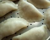 A picture of step 10 of Pitha (Bengali Coconut-Stuffed Pitha).