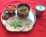 A picture of step 5 of Ringan (Brinjal) Oro and Sorghum, Pearl Millet Chapti.