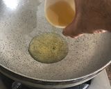 A picture of step 5 of Dahi wala Kukkad Chicken in yoghurt curry base.