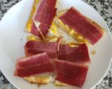 A picture of step 1 of My breakfast today 😋 🍞🧀🥓.