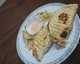 A picture of step 10 of Chatpata naan with aloo tikki wrap.