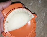 A picture of step 9 of Frozen chicken samosy D shape.