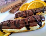 A picture of step 16 of Choco orange eclair with fresh cream...cup of hot chocolate.