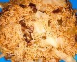 A picture of step 8 of Jollof rice with cabbage.