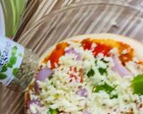 A picture of step 4 of Pizza with readymade Pizzabase.