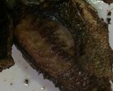 A picture of step 2 of Fried Tilapia fish with onion sauce.
