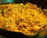 A picture of step 5 of Multi colored pilaf with broccoli, red and orange bell peppers, and carrots.