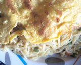 A picture of step 2 of Indomie Noodles and fried eggs.