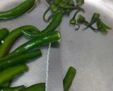 A picture of step 1 of Green chilli pickle.