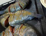 A picture of step 4 of Turmeric fried fish.