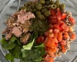 A picture of step 4 of Farro Salad with Pesto, Iceberg Lettuce, Basil, Green Olives, Tomatoes, and Tuna.
