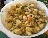 Une image de l'étape 16 de Salade marinée de pommes de terre au porc, oignons nouveaux et tomates orange.