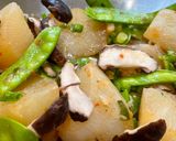 A picture of step 11 of Daikon Radish with Shiitake Mushrooms and Snow Peas.