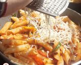 A picture of step 7 of Penne Arrabiata.