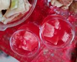 A picture of step 6 of Street style water melon with red juice.