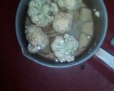 A picture of step 1 of Aloo fulcopi katla rosha ar misti doi.