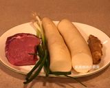 A picture of step 1 of Braised Pork with Daikon Radish.