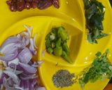 A picture of step 7 of Karhi pakora with curry leaves.