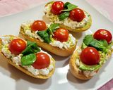 A picture of step 7 of Toasts with Cottage Cheese, Cherry Tomatoes, Guacamole, and More.