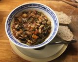 A picture of step 9 of Italian Tomato Stew with Kale and Cannelini beans.
