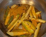 A picture of step 7 of Katla fish curry with raw mango.