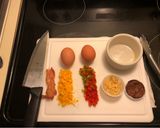 A picture of step 1 of Easy Cheesey Spicy Jerk Egg Soufflé with peppers & bacon.