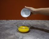 A picture of step 4 of Molecular gastronomy-mango juice spherification.