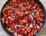 A picture of step 4 of Dakos salad | Cretan salad.