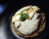 A picture of step 5 of Sufiyana paneer(on the bed of lachcha parantha).