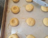 A picture of step 6 of Jam Thumbprint Cookies.