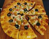 A picture of step 7 of Cheesy Bites Tikka Pizza 🍕🍕.