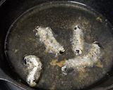 A picture of step 3 of Fried mopane worm.
