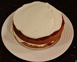 A picture of step 19 of Vanilla Lemon Raspberry Layer Cake with Whipped Cream Buttercream Frosting.