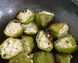 A picture of step 4 of Punjabi Paneer stuffed Capsicum in Red Gravy.