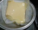 A picture of step 2 of No bake pumpkin cake.