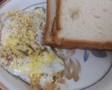 A picture of step 3 of Half fried egg with bread for breakfast.