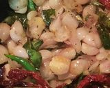 A picture of step 2 of Ulli theeyyal (shallots cooked in roasted coconut gravy and tamarind juice).