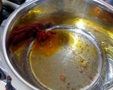 A picture of step 1 of Potato-Brinjal Curry.