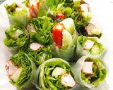 A picture of step 4 of Crab Stick Salad Rolls with Wasabi Dressing - Bento Box Menu.