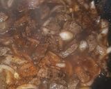 A picture of step 3 of Kibda (Egyptian liver sauce) and French fries.