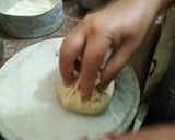 A picture of step 3 of Muli de parathe with batter and dahi.